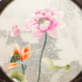 Load image into Gallery viewer, Double-sided embroidery of pink and orange lotus blossoms with green leaves in a round dark hardwood frame on a scroll-carved wooden stand