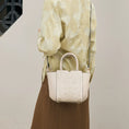 Load image into Gallery viewer, SinoCrafted Suzhou embroidery crossbody handbag with delicate floral patterns, styled by a woman in a modern Chinese-inspired setting.