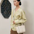 Load image into Gallery viewer, SinoCrafted Suzhou embroidery crossbody handbag with delicate floral patterns, styled by a woman in a modern Chinese-inspired setting.