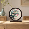 Load image into Gallery viewer, Pheasant and peony embroidery ornament on a wooden console table with a celadon vase in a softly lit traditional room

