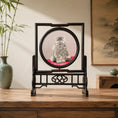 Load image into Gallery viewer, Double-sided embroidery of a fluffy grey cat sitting on a red cushion in a round frame within a rectangular hardwood screen stand with scroll-carved base
