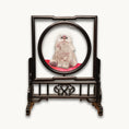Load image into Gallery viewer, Double-sided embroidery of a fluffy grey cat sitting on a red cushion in a round frame within a rectangular hardwood screen stand with scroll-carved base
