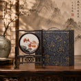 Load image into Gallery viewer, Double-sided embroidery of a brown and white Pekingese dog standing on a rock in a circular frame within a rectangular hardwood screen stand
