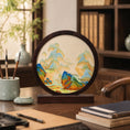 Load image into Gallery viewer, Round landscape embroidery ornament displayed on a wooden console table in a traditional Chinese room setting
