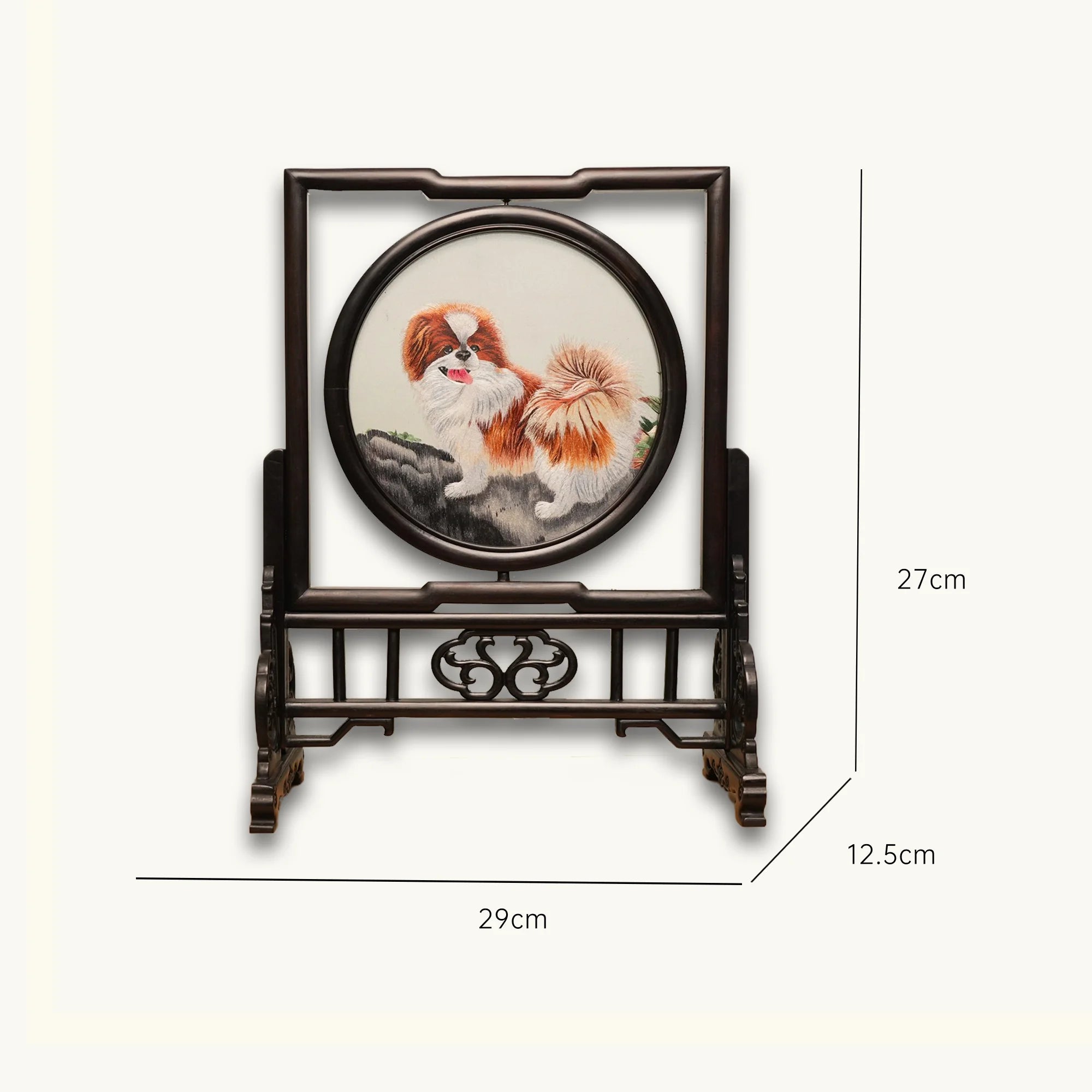 Double-sided embroidery of a brown and white Pekingese dog standing on a rock in a circular frame within a rectangular hardwood screen stand