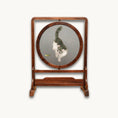 Load image into Gallery viewer, Round double-sided embroidery on hardwood stand showing white and gray cat reaching toward a green grasshopper on gray silk background
