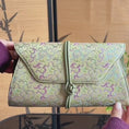 Load and play video in Gallery viewer, Chinoiserie Luxury Song Brocade Scrolling Vine Kui Dragon Leather Clutch Bag
